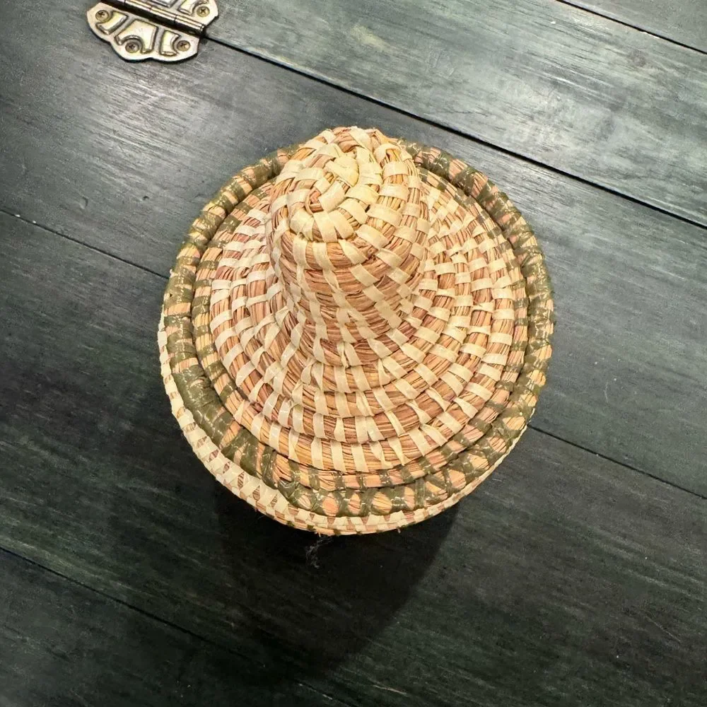 Handwoven sweetgrass coiled basket with a fitted lid